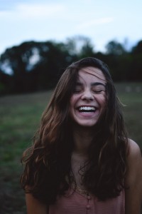 Girl Laughing in a Field