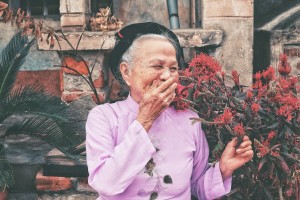 Old Woman Laughing in a Pink Shirt