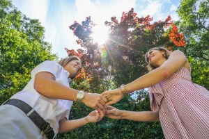 Couple Holding Hands in Sun
