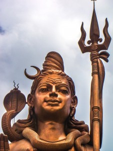 Golden Hindu Statue against the Blue Sky