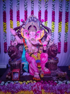 Pink Hindu Statue covered in Flowers