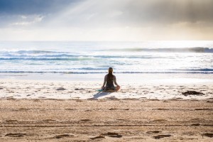Woman Chanting in Ocean Tide