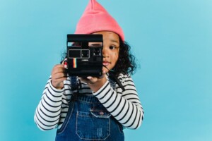 A kid being a creative human with a camera