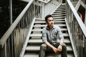 Man Sitting on Steps
