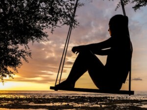 Person in Sunset on a Swing