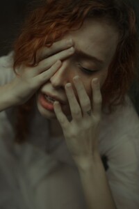 Anxious Lady with Hands on Face