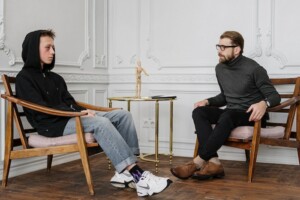 Boy and Man Talking in Therapy