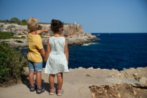 Children Looking Out at Ocean