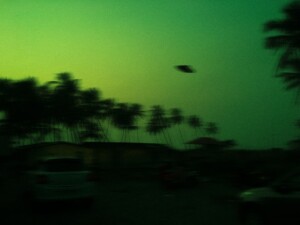 Green UFO in Sky