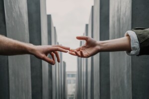 Hands Reaching Out Together