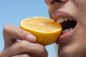 Teeth Biting an Open Lemon