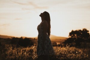Woman in the Sun Reaching Her Higher Self