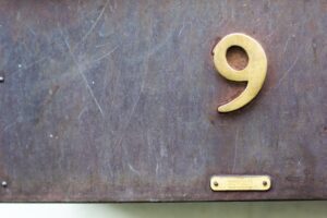 Metal Number 9 on a Book