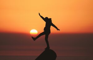 A person balancing on a Rock